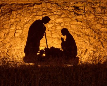 nominated-the-silhouettes-of-mary-and-joseph-of-earthly-parents-bowed-over-the-newborn-jesus-christ_t20_gopBXx